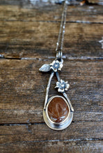 Load image into Gallery viewer, Modern and unique sterling silver necklace with brick red beach stone hanging from a sterling silver chain with handmade clasp.