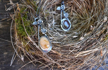 Load image into Gallery viewer, Modern and unique sterling silver necklace with brick red beach stone hanging from a sterling silver chain with handmade clasp.