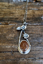 Load image into Gallery viewer, Modern and unique sterling silver necklace with brick red beach stone hanging from a sterling silver chain with handmade clasp.
